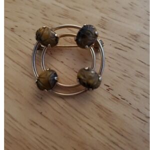 Vintage Monet circular gold tone brooch
